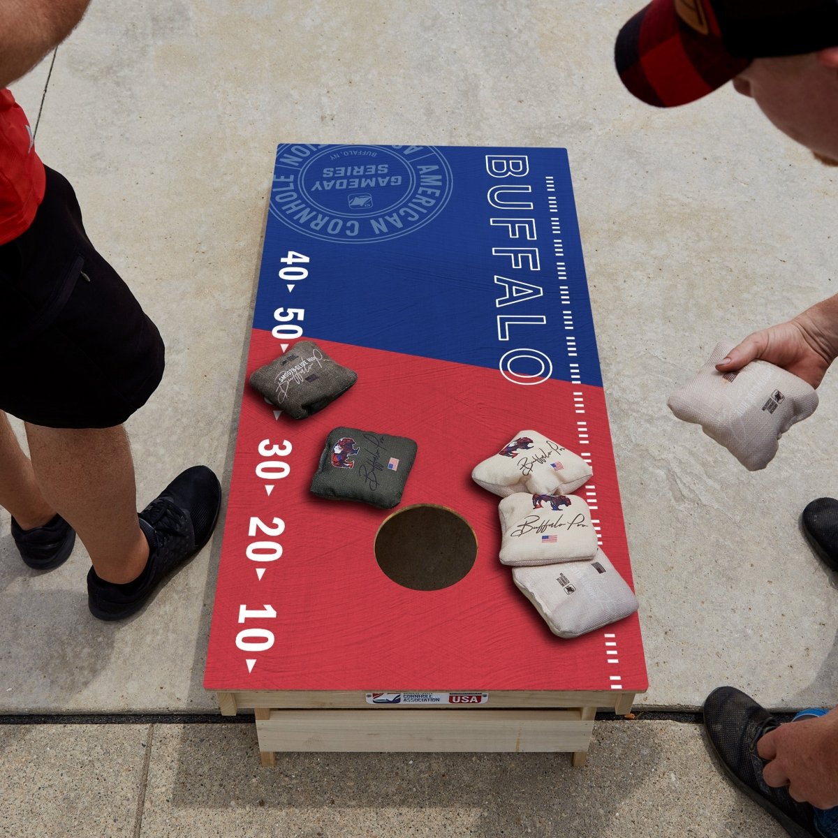 Premium wooden cornhole board with game day stadium graphics.