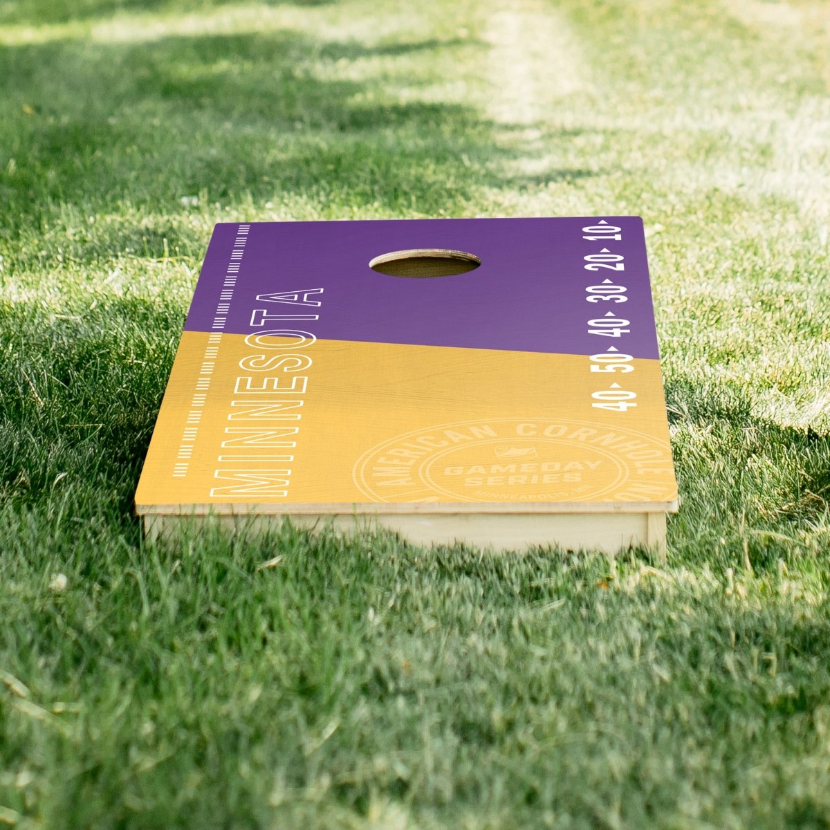 Premium wooden cornhole board with game day stadium graphics.